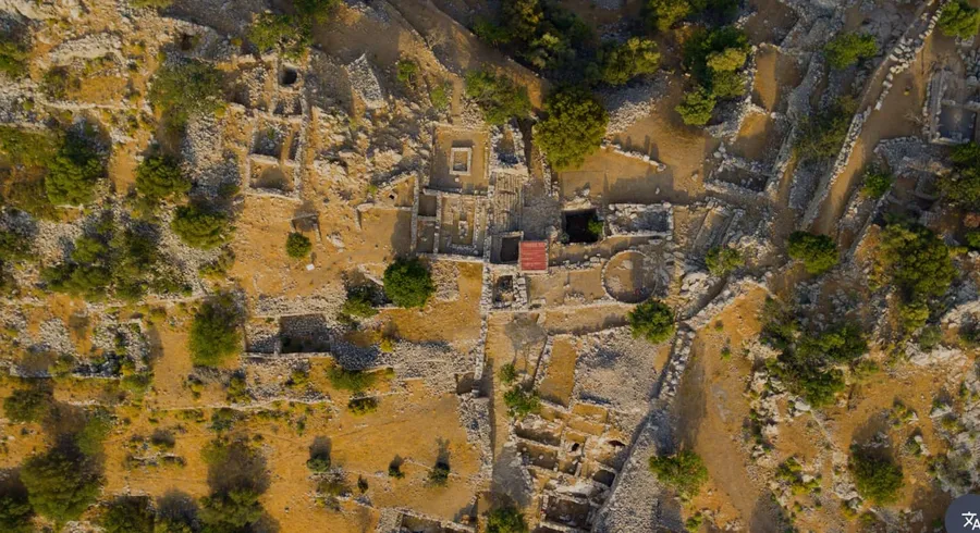 Aerial view of the ancient city of Lato ruins on a hilltop landscape